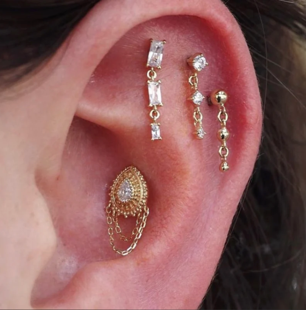 healed conch piercing with 14k gold threadless end